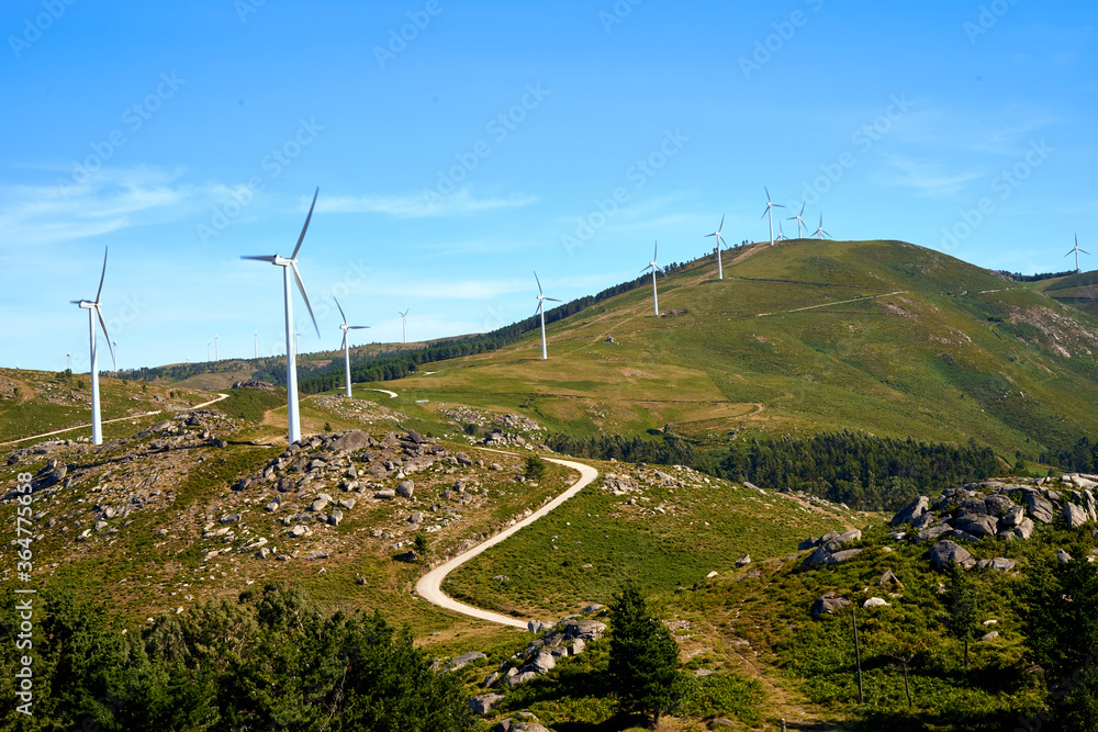 mountains with windmills and blue sky mountains with windmills and blue sky