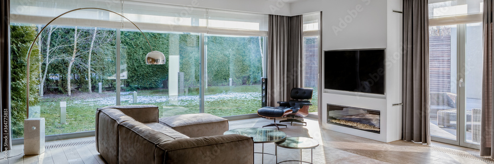 Fototapeta premium Living room with window wall, panorama