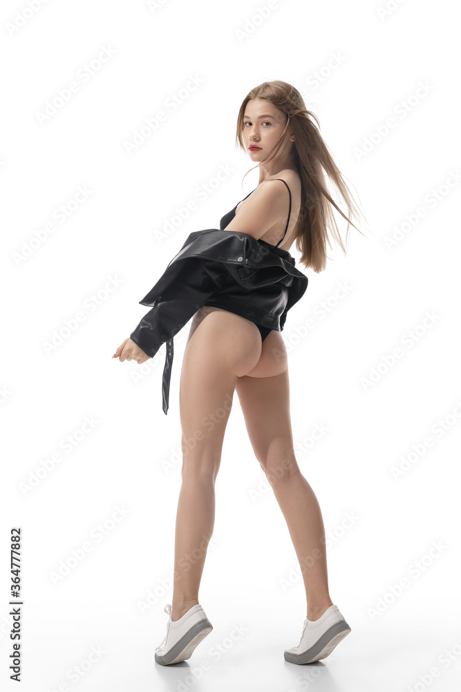 Portrait of beautiful young woman isolated on white studio background. Concept of beauty, skin care, fashion and style. Artwork, modern and trendy portrait. Attractive model in black bodysuit. Portrait of beautiful young woman isolated on white studio background. Concept of beauty, skin care, fashion and style. Artwork, modern and trendy portrait. Attractive model in black bodysuit.