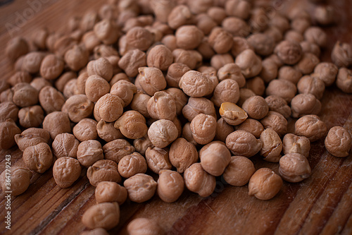 Chickpea grains on wooden background