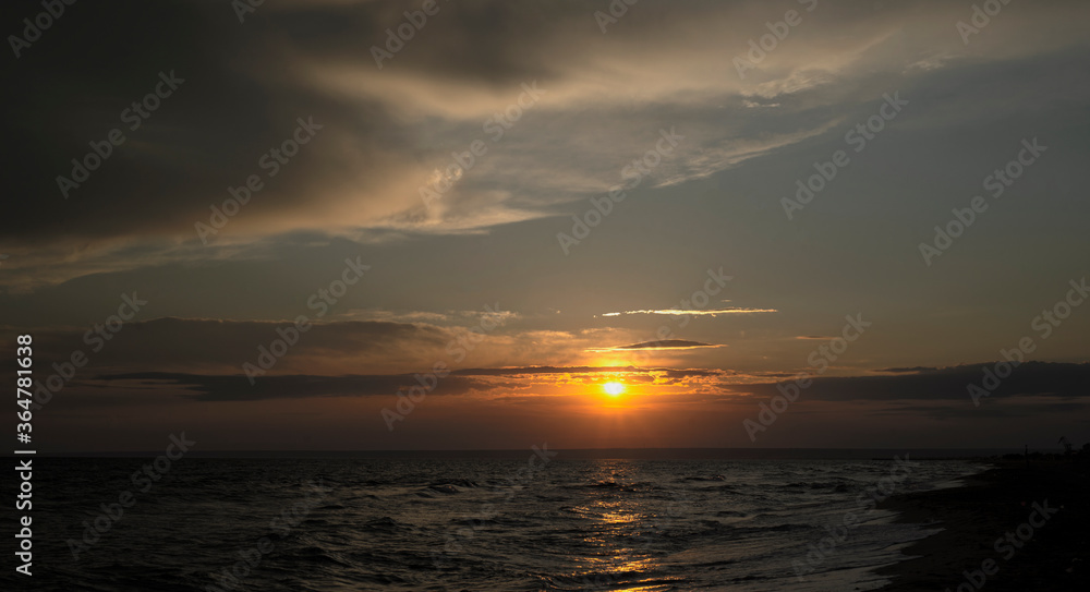  Seascape at dusk. The sun sets over the sea. Copy space for text.