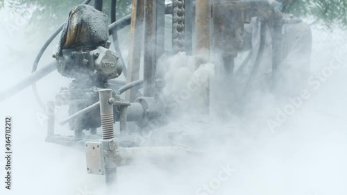 Super fine dust particles emitted from a bore well digging machine in slow motion