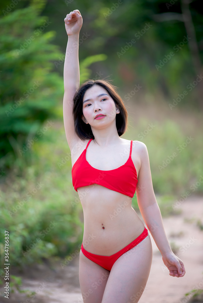 Portrait of asian sexy woman wear bikini at outdoor,Summer concept,Lifestyle of modern women Portrait of asian sexy woman wear bikini at outdoor,Summer concept,Lifestyle of modern women