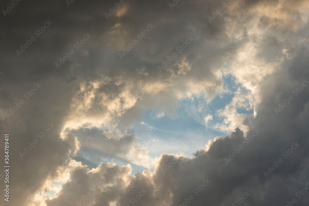 dark cumulus clouds white window among the dark sky