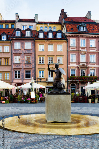 WARSAW, POLAND - OCTOBER 25, 2016: Beautiful Tenement houses on the street Nowomiejska and street Freta, Old Market Square in Warsaw, the capital of Poland, Europe photo