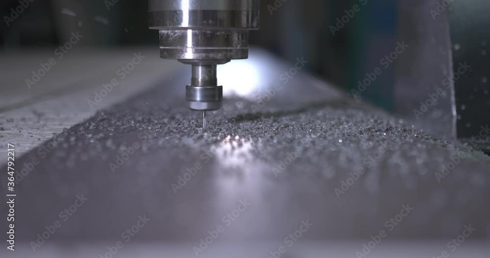 Shavings fly from the cutter, close-up. Factory milling installation, cnc. Shavings fly from the cutter, close-up. Factory milling installation, cnc.