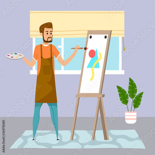 Young guy drawing abstract picture, triangle amd circle at easel using paint and brush. Home activity or leisure time. Houseplant, window with curtains, carpet decorate room. Quarantine self-isolation