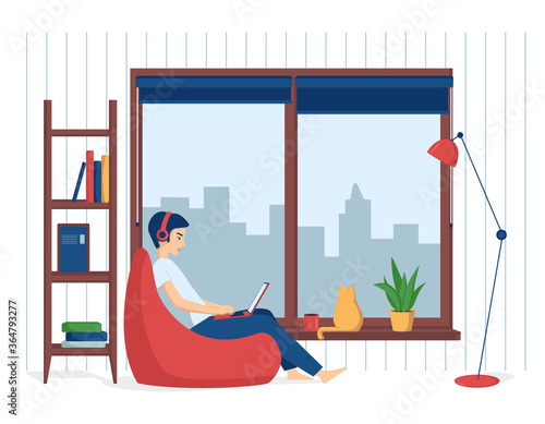 A young man in headphones sits in a bin bag with a laptop. The concept of remote work from home, distance education, programming, freelance, e learning. Vector illustration in a flat style.
