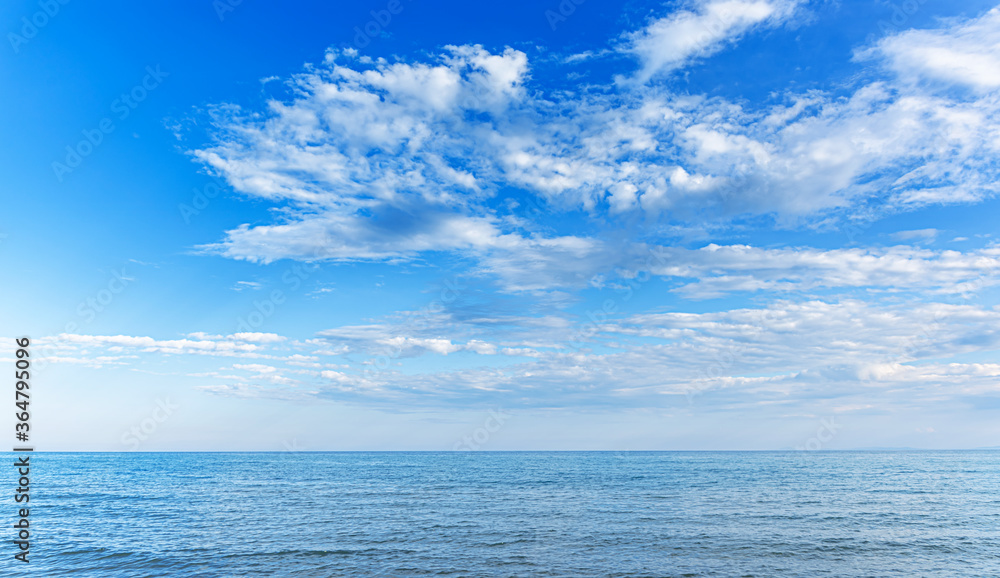 Fototapeta premium Seascape at sunset. Beautiful evening sky at sunset and sea surf.