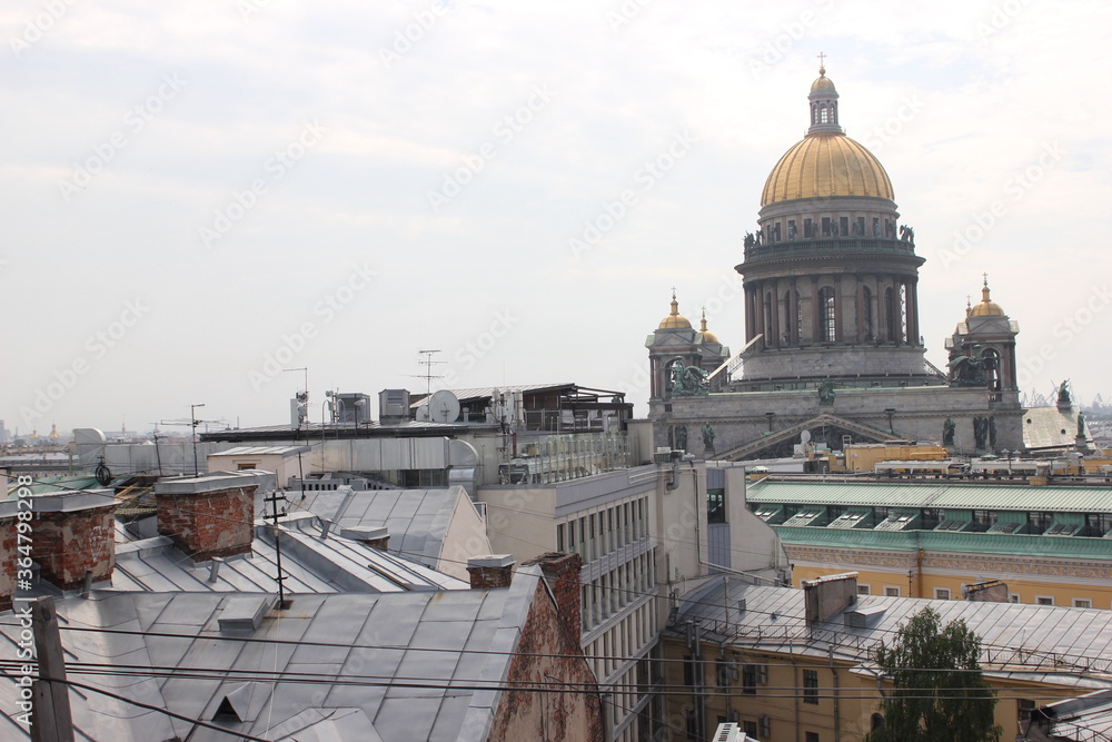 Saint-Petersburg, Russia - 10.06.20. Cityscape panorama of old central city part, view from a roof. Famous rooftops of St. Petersburg with Saint Isaac's Cathedralat the background.