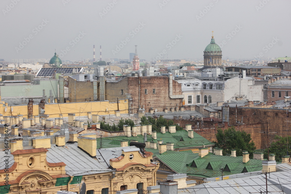 Saint-Petersburg, Russia - 10.06.20. Cityscape panorama of old central city part, view from a roof. Famous rooftops of St. Petersburg with Saint Isaac's Cathedralat the background.