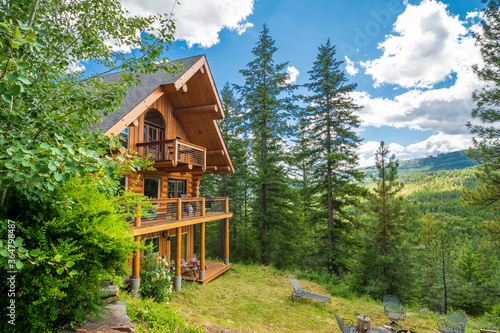 Fototapeta A 3 story log home with decks in the mountains near Coeur d'Alene, Idaho, USA