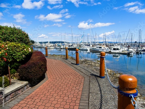 Tranquil walkway around marina with moored yachts in Sidney on Vancouver Island, British Columbia, Canada © pr2is
