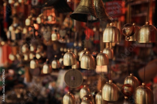 Close up shot of the handmade souvenirs items, are being sold in the handicraft shop in the Uttarakhand, India with selective focus. Brass made items for sale.