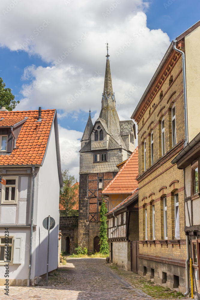 Cobblestoned street leading to the historic Kuhhirtenturm tower in Quedlinburg, Germany