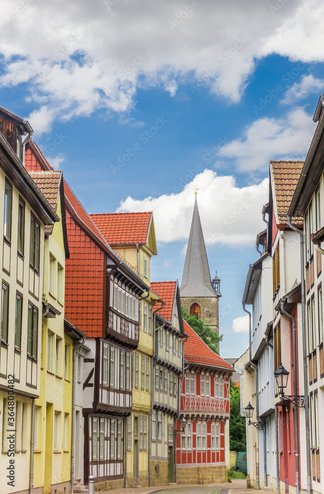 Street with colorful houses and church tower in Quedlinburg, Germany