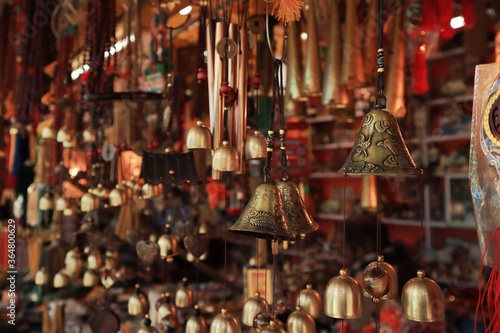 Close up shot of the handmade souvenirs items, are being sold in the handicraft shop in the Uttarakhand, India with selective focus. Brass made items for sale.