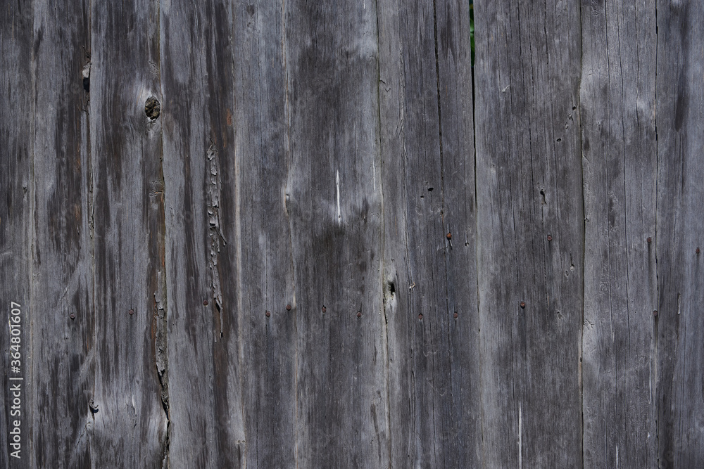 Natural background of old boards and old nails inside

V