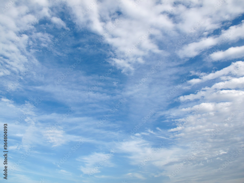 Obraz premium Heart-shaped clouds in the blue sky during the day