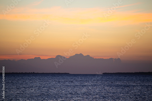 Dark sunset over the ocean shore. Africa.