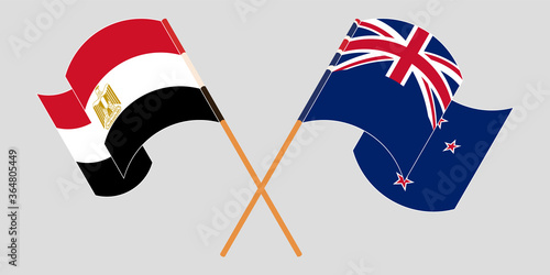 Crossed and waving flags of Egypt and New Zealand