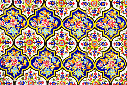 Colorful oriental geometric design and pattern commonly met in Persian mosques and medresses. Isfahan, Shiraz, Teheran, Iran photo
