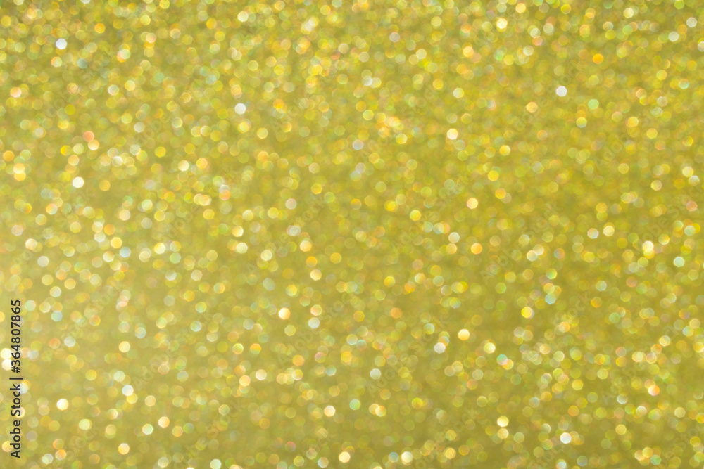 Gold abstract background with bokeh, defocused Christmas lights. Festive concept. Selective focus. Gold abstract background with bokeh, defocused Christmas lights. Festive concept. Selective focus.