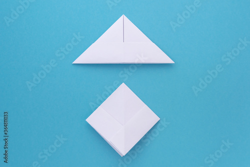 assembly procedure for a white paper ship. Origami.