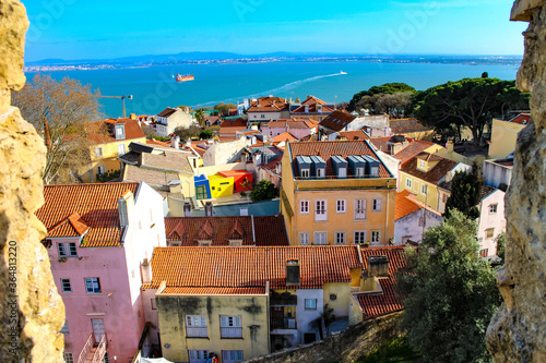 Scenic high angle view of Lisbon cityscape and the Atlantic ocean from Castelo de São Jorge, Lisbon, Portugal. 