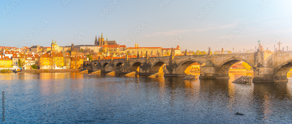 Panoramic view of Prague Castle and Charles Bridge on sunny spring morning, Praha, Czech Republic