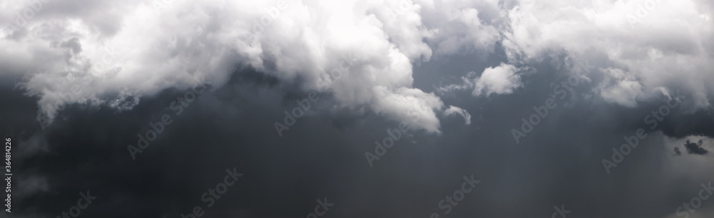 Panorama of the dark stormy sky with gray clouds. Beautiful cloudscape. Panorama of the dark stormy sky with gray clouds. Beautiful cloudscape.