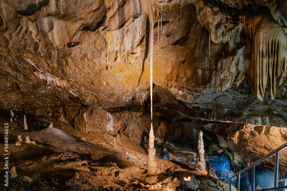 Long thin limestone stalactite and opposite stalagmite in Punkva Caves, Moravian Karst, Czech Republic Long thin limestone stalactite and opposite stalagmite in Punkva Caves, Moravian Karst, Czech Republic