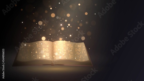 Open golden magic book with fairy tales or spells in dark room and bright light