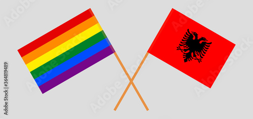 Crossed flags of LGBT and Albania