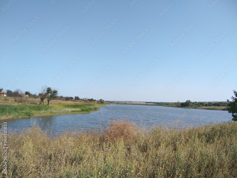 landscape with river and blue sky