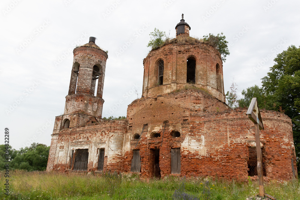 Abandoned church of red brick in Ivanovo village Kotsyno in summer day