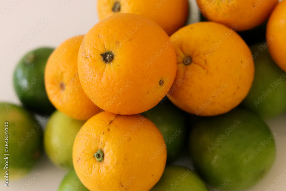 Beautiful lemons and oranges arranged on a table. A fruit rich in vitamin c. Beautiful lemons and oranges arranged on a table. A fruit rich in vitamin c.