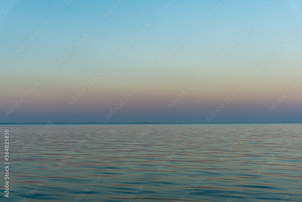 horizon on lake with gradient sky and soft waves horizon on lake with gradient sky and soft waves