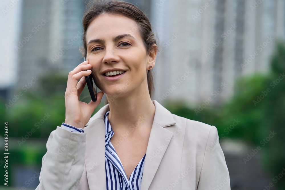 Close-up of businesswoman talking on smartphone Close-up of businesswoman talking on smartphone