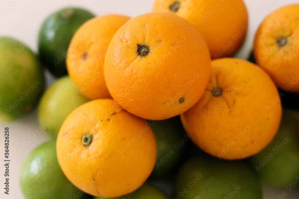 Beautiful lemons and oranges arranged on a table. A fruit rich in vitamin c. Beautiful lemons and oranges arranged on a table. A fruit rich in vitamin c.