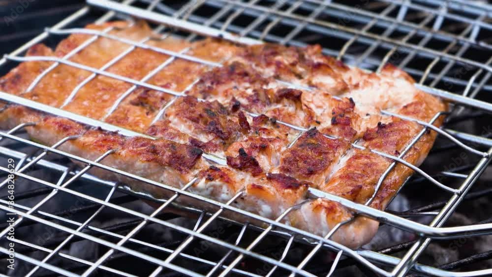 Grilled salmon, fish on the barbecue grill, close-up, 4K Grilled salmon, fish on the barbecue grill, close-up, 4K