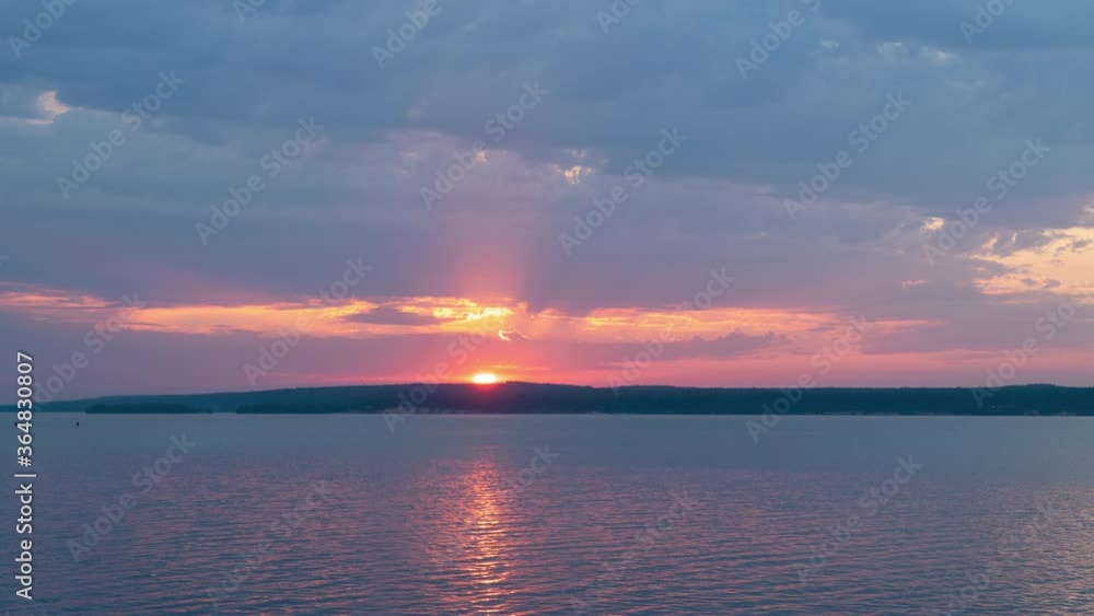 Timelapse of a sunset over a river in summer Timelapse of a sunset over a river in summer