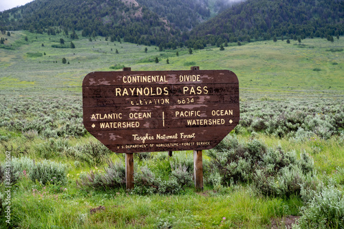 Continental Divide - Raynolds Pass sign in the Targhee National Forest on the Idaho and Montana border along Highway 87 photo