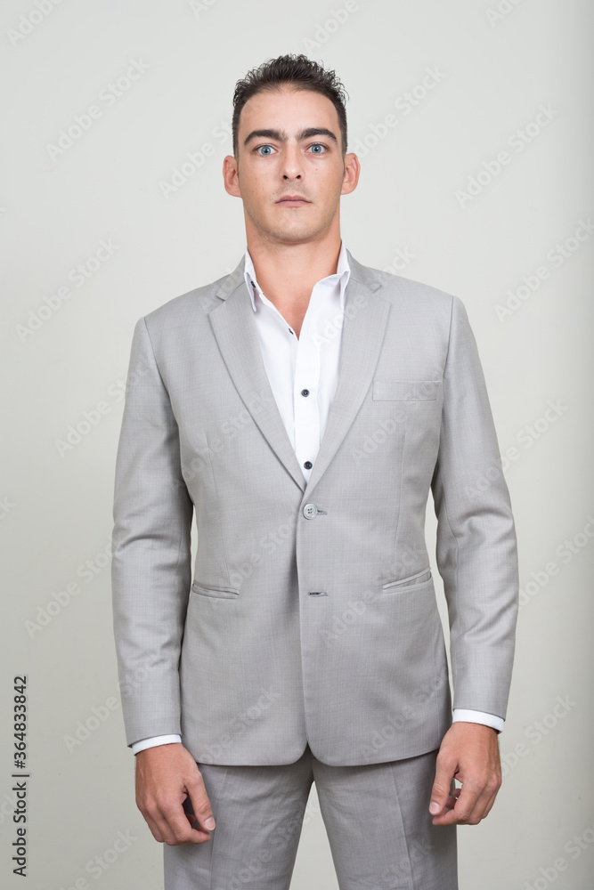 Portrait of young handsome businessman wearing suit Portrait of young handsome businessman wearing suit