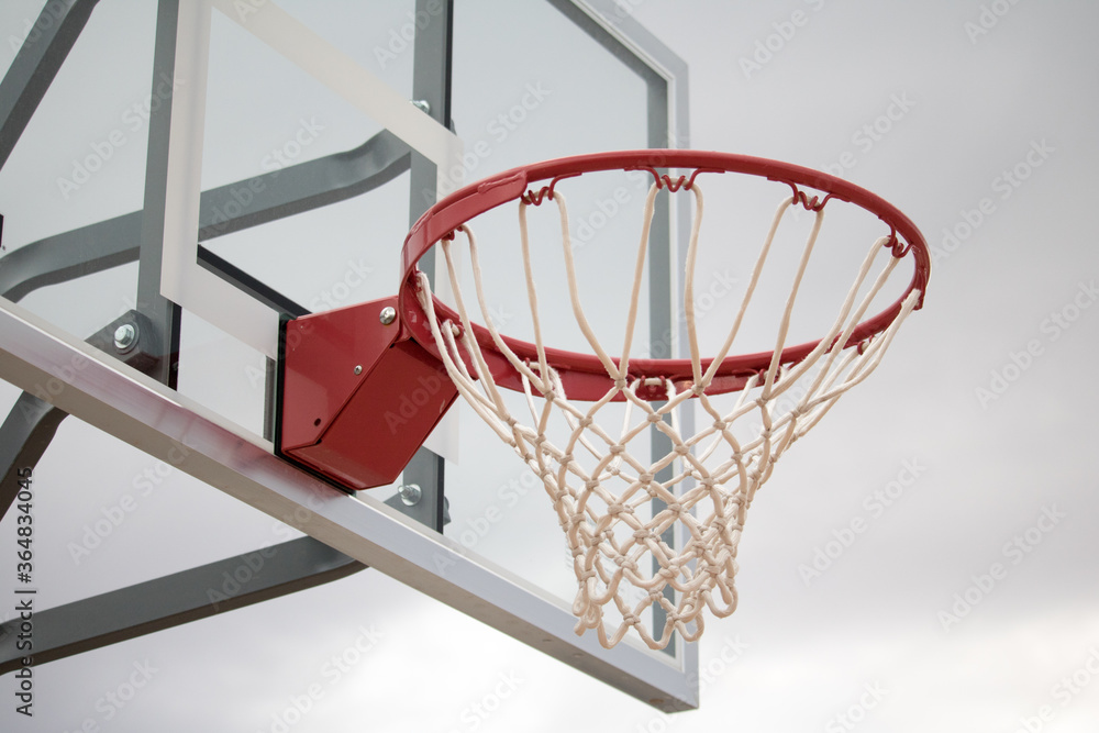 Close up of a netted basketball hoop ready for some b-ball action.