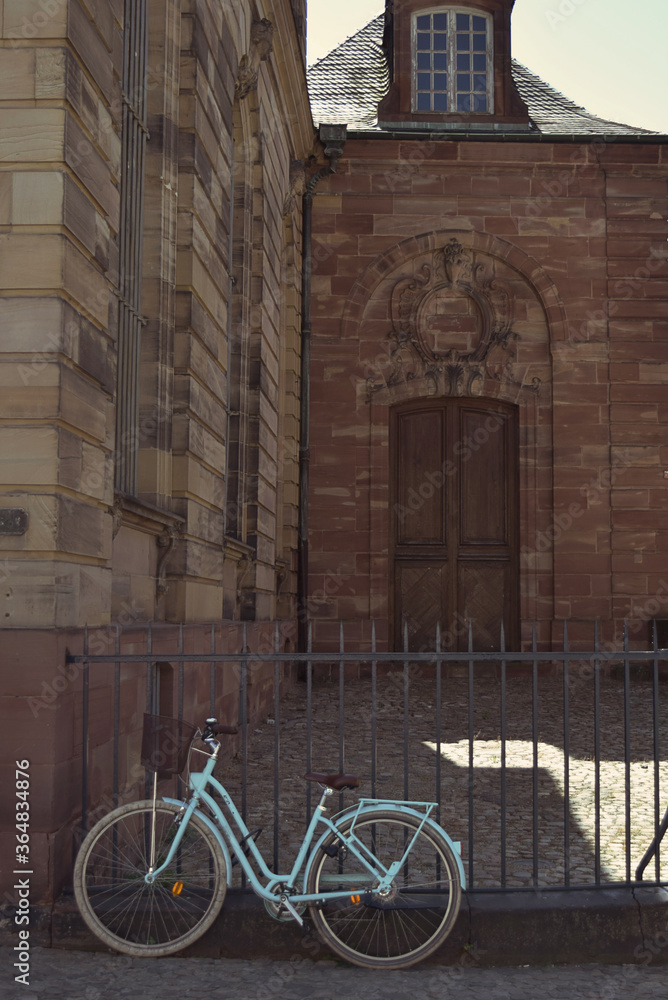 Blue retro bicycle outside a building in Strasbourg, France