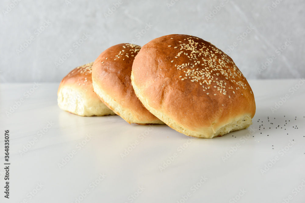 hot homemade buns with sesame and poppy seeds