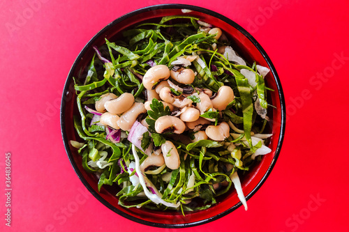 bowl of green salad and white beans