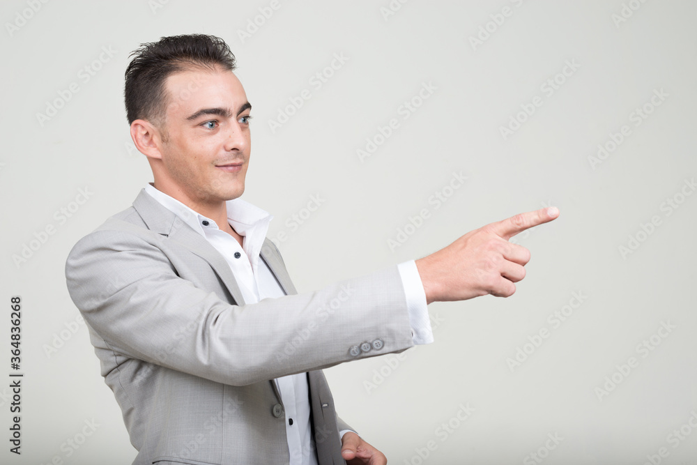 Portrait of young handsome businessman wearing suit Portrait of young handsome businessman wearing suit