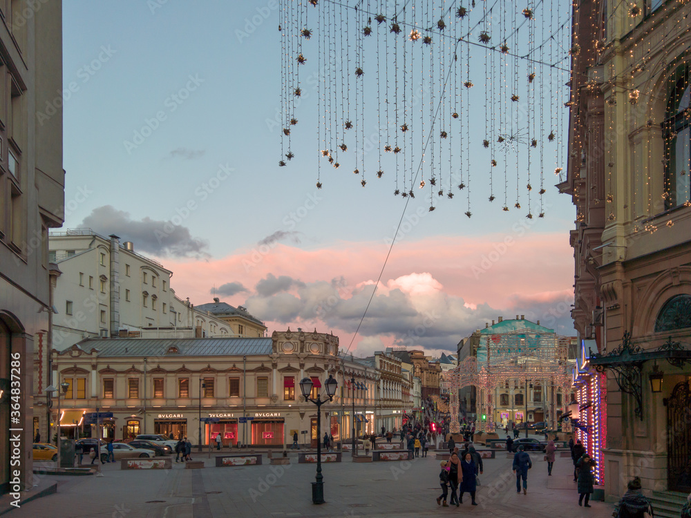 View of the sunset sky from Kuznetsky Most Street towards the square near the Central Department Store
